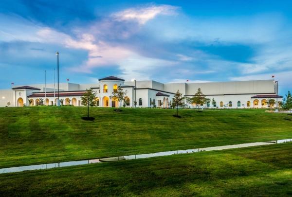 Facility exterior at dusk.